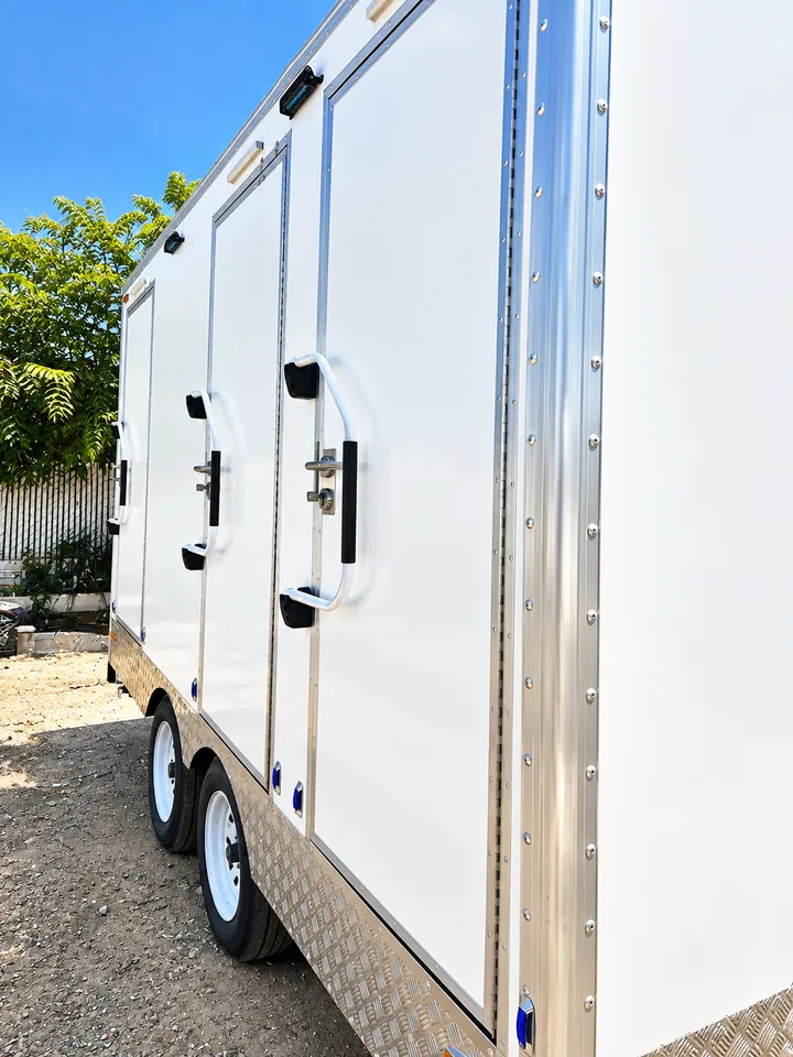 Double-door exterior of a 13 ft luxury shower-restroom combination trailer