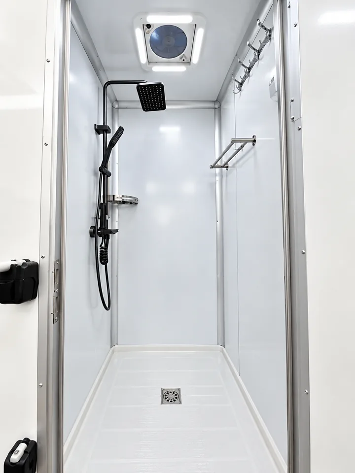 Wash station inside a five-stall 20 ft mobile shower container