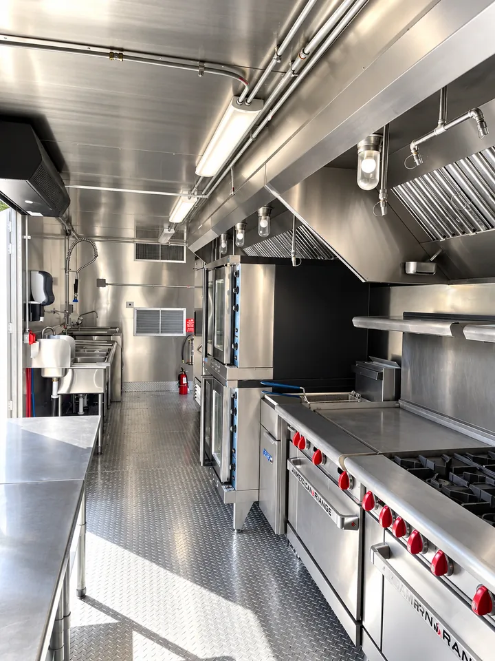 Cooking line and ventilation inside a 40 ft mobile combo kitchen
